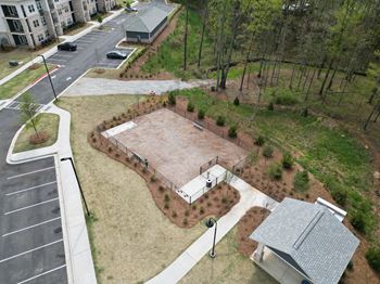 A playground with a slide and a swing set at The Crest at South Point Apartments, Davenport , GA, 30253